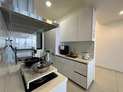 a kitchen with a stove with a bowl on it at HOT & Modern 2BR Beacon Executive Suite, Georgetown in George Town