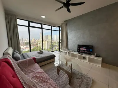 a living room with a ceiling fan and a large window at HOT & Modern 2BR Beacon Executive Suite, Georgetown in George Town