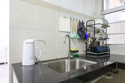 a kitchen with a sink and aaucet at Happy Nest Cameron Highland Brinchang 10 Pax Family Homestay Clover Home 5-23 in Brinchang