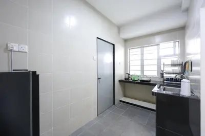 a small kitchen with a sink and a door at Brinchang Highland Breeze Family 10 Pax Nest Unit Cameron Highland Clover Home 5-23A in Brinchang