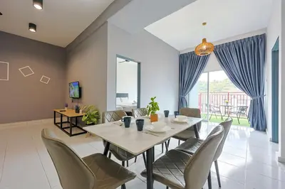 a dining room with a table and chairs at Chill & Bloom Brinchang Cameron Highlands Clover Home M-02 in Brinchang