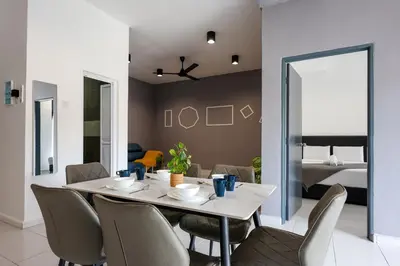 a dining room with a table and chairs and a bedroom at Chill & Bloom Brinchang Cameron Highlands Clover Home M-02 in Brinchang