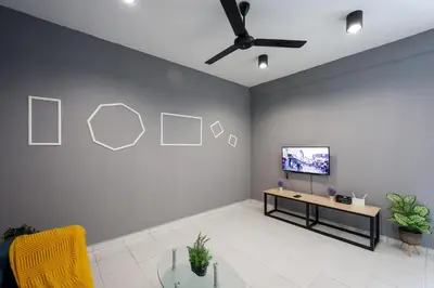 a living room with a flat screen tv on a wall at Chill & Bloom Brinchang Cameron Highlands Clover Home M-02 in Brinchang