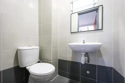 a bathroom with a toilet and a sink at Cloverhill Emerald Avenue Apartment Highland Brinchang Elegance Stay Clover Home 5-03 in Brinchang