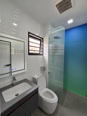 a bathroom with a toilet and a sink and a shower at Cozy Nook Stay Bukit Tinggi 2 in Kuang