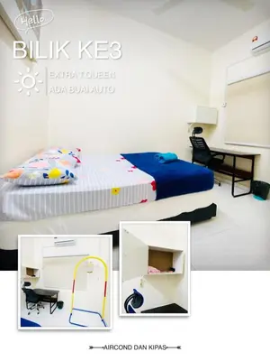 a picture of a bedroom with a bed and a desk at Homestay Bajet Teluk Intan in Teluk Intan