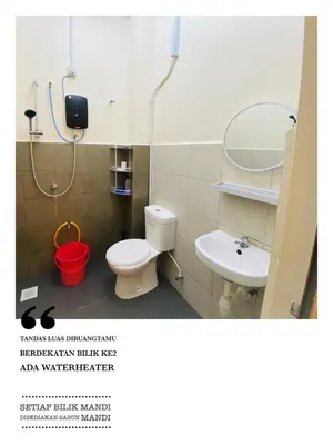 a bathroom with a toilet and a sink at Homestay Bajet Teluk Intan in Teluk Intan