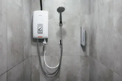 a shower with a hose attached to a wall at Cameron Centrum CozyNest with Kids Playground Brinchang Clover Home A-1-15A in Brinchang