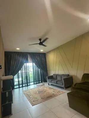 a living room with a couch and a ceiling fan at Adik Aisyah homestay quintet 7-2 in Tanah Rata