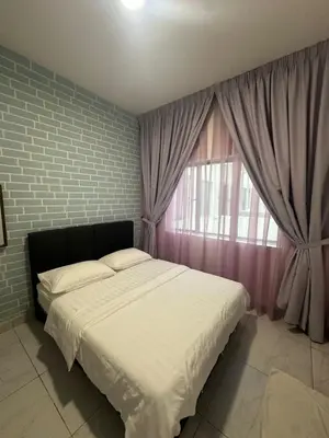 a bedroom with a large bed and a window at Adik Aisyah homestay cameron quintet A3-7-3 in Tanah Rata