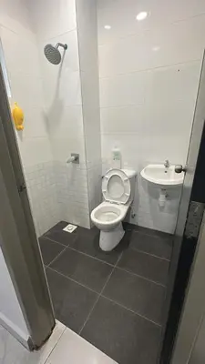 a bathroom with a toilet and a sink at Adik Aisyah homestay cameron quintet A3-7-3 in Tanah Rata