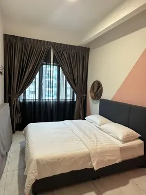 a bedroom with a large bed and a window at Adik Aisyah homestay cameron quintet A3-7-3A in Tanah Rata