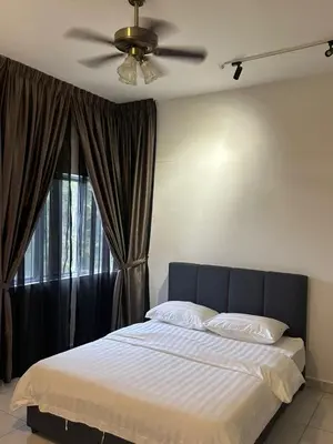 a bedroom with a bed with a ceiling fan and a window at Adik Aisyah homestay cameron quintet A3-7-3A in Tanah Rata