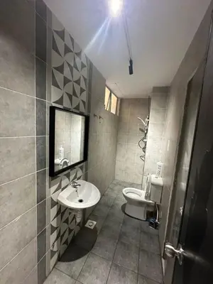 a bathroom with a sink and a toilet at Adik Aisyah cameron homestay quintet A3-7-5 in Tanah Rata