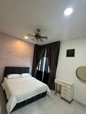 a bedroom with a bed and a ceiling fan at Adik Aisyah cameron homestay quintet A3-7-5 in Tanah Rata