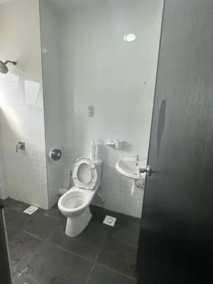 a bathroom with a toilet and a sink at Adik Aisyah cameron homestay quintet A3-7-5 in Tanah Rata