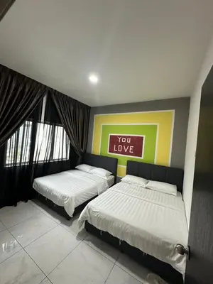 a bedroom with two beds and a sign that says you love at Adik Aisyah cameron homestay quintet A3-7-5 in Tanah Rata