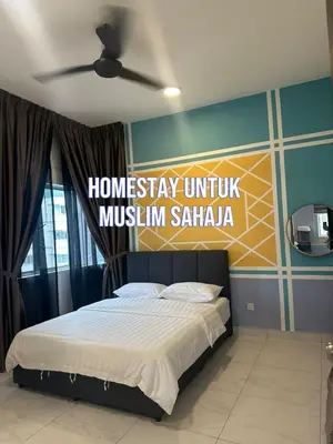 a bedroom with a bed with a sign on the wall at Adik Aisyah cameron homestay quintet A3-7-7 in Tanah Rata