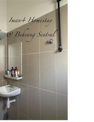 a bathroom with a sink and a mirror at Iman4 Homestay in Kampung Behrang
