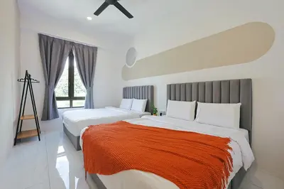 a bedroom with two beds and a large window at Cameron Centrum Brinchang JoyStay Private Kids Playground Clover Home A-2-15 A in Brinchang