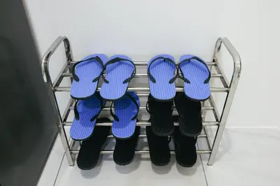 three pairs of flip flops on a rack at Cameron Centrum Brinchang Breeze Cozy Retreat Clover Home A-2-15B in Brinchang