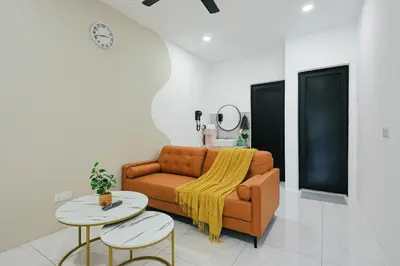 a living room with a couch and two tables at Cameron Centrum Family Haven Kids Private Playground Clover Home A-3-15A in Brinchang