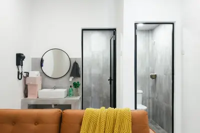 a living room with a couch and a mirror at Cameron Centrum Family Haven Kids Private Playground Clover Home A-3-15A in Brinchang