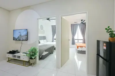 a bedroom with a bed and a tv in a room at Cameron Centrum Brinchang ChillSuites Peaceful Escape Clover Home A-3-15B in Brinchang