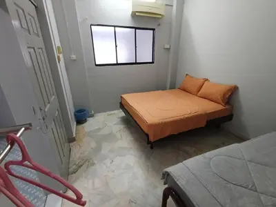 a small bedroom with a bed and a window at 50 Canning Garden Homestay in Ipoh
