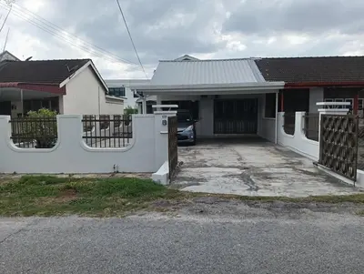 a house with a white fence and a driveway at 50 Canning Garden Homestay in Ipoh