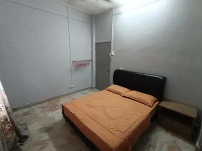 a small bedroom with a bed in a room at 50 Canning Garden Homestay in Ipoh