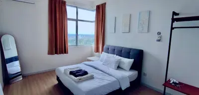 a bedroom with a bed with a large window at Rainy Sanctuary Homestay With Netflix - 1 Parking in Taiping