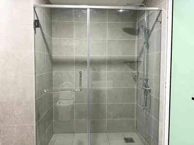 a shower with a glass door in a bathroom at ICC Suites Ipoh 16th floor in Ipoh