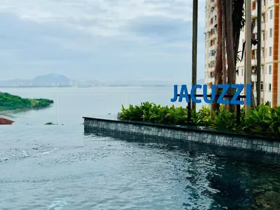 a sign on a building next to a body of water at Comfort Stay Family Home 3BR-10PAX b30 in George Town