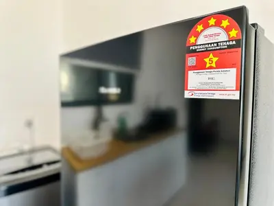 a sign on the side of a refrigerator in a kitchen at Comfort Stay Family Home 3BR-10PAX b30 in George Town