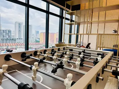 a row of tables in a room with windows at Comfort Stay Family Home 3BR-10PAX b30 in George Town