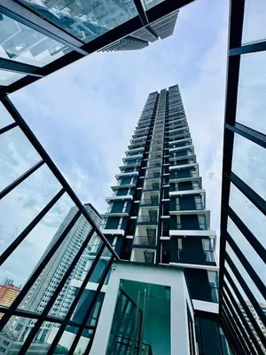 a tall building looking up into the sky at Comfort Stay Family Home 3BR-10PAX b30 in George Town