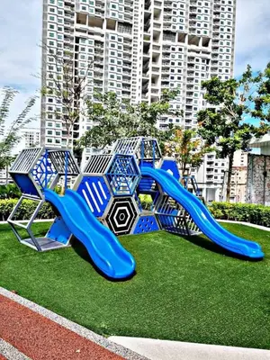 a playground with a slide in the grass at Comfort Stay Family Home 3BR-10PAX b30 in George Town