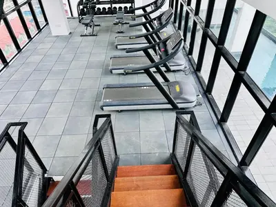 a row of chairs sitting on a balcony at Cozy Sea & City View Penang, 3BR-10PAX b30 in George Town