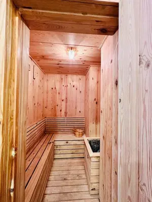 a sauna with wooden walls and a wooden floor at Cozy Sea & City View Penang, 3BR-10PAX b30 in George Town