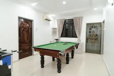 a living room with a pool table in it at Bm16 16pax4b3b in Bukit Mertajam
