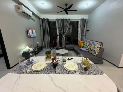 a living room with a table and a couch at 3BR-Apartment-Netflix,Cozy,Peaceful FamilyHomes b30 in George Town