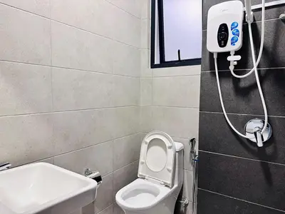 a bathroom with a white toilet and a sink at 3BR-Apartment-Netflix,Cozy,Peaceful FamilyHomes b30 in George Town