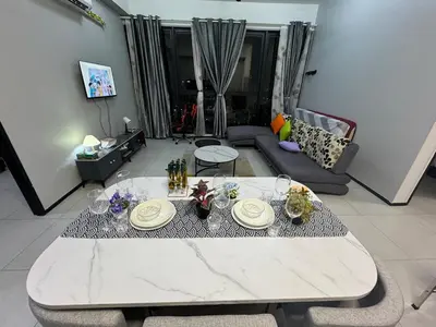 a living room with a table and a couch at 3BR-Apartment-Netflix,Cozy,Peaceful FamilyHomes b30 in George Town