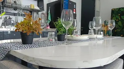a table with wine glasses on top of it at relax familystay Urban suites 3BR-10pax b30 in George Town