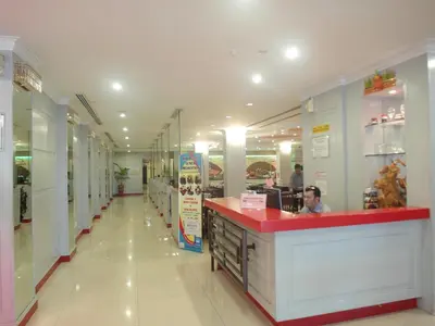 a fast food restaurant with a red counter in a store at Red Rock Hotel Penang in George Town