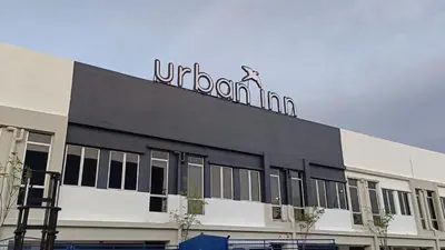 a black building with a sign on top of it at Urban Inn, Cengal Jaya in Sungai Petani