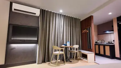 a living room with a table and two chairs at Urban Inn, Cengal Jaya in Sungai Petani
