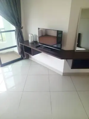 a television sitting on a table in a room at Marina sunset view in Lumut