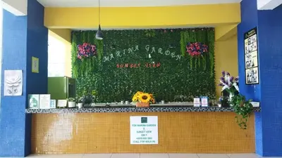 a flower shop with a counter with flowers on it at Marina sunset view in Lumut